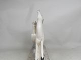 a statue of a horse that is sitting on top of a table
