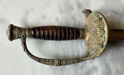 a close up of a sword that is on a table