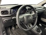 the interior of a car with a steering wheel and dashboard controls