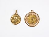 two pieces of gold coin with a face of jesus on it