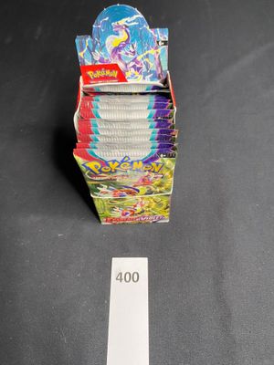 a close up of a stack of cards on a table next to a ruler