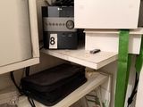 a small closet with a lot of items on the shelves
