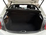the back of a car with its trunk open and the back seat down