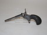 an old gun that is on display on a table