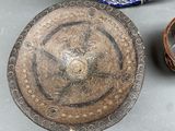 two bowls and a bowl sitting on a table