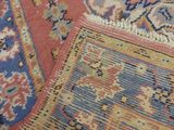 an image of a close up of a rug with a cat laying on it