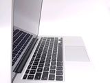 a close up of a laptop computer on a white surface