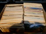 a box full of old records sitting on a table