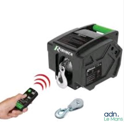 the remote control of a winch being operated by a hand