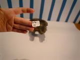 a person holding a small piece of paper with a price tag on it