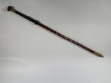 a close up of a pen on a white surface with a white background