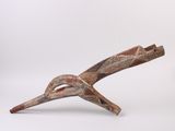 an image of a wooden sculpture of a bird on a white background