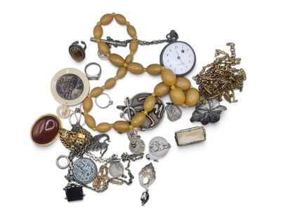 a pile of assorted jewelry on a white surface