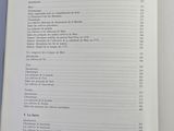 a book open to a list of items on a table