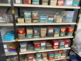 a shelf with many different types of paint in it