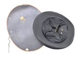 a black hat that is sitting on top of a box