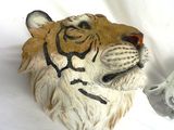 a statue of a tiger on a white background