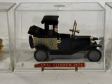 a small toy car in a glass case