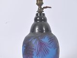 a blue vase with a purple and black design on it