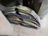 a pile of luggage sitting on the floor next to a fire place