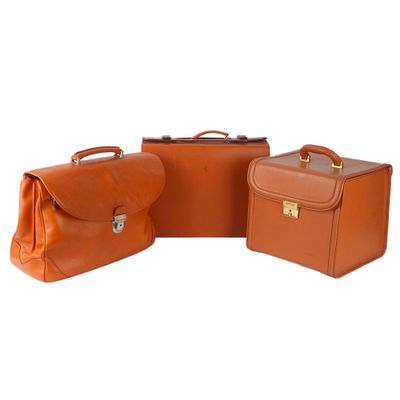 three pieces of luggage sitting next to each other on a white surface