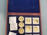 a box of gold coins with a note in it on a table