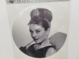 an old photo of a woman with a cigarette in her mouth