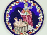 une photo d'une assiette décorative sur laquelle figurent un homme et un enfant