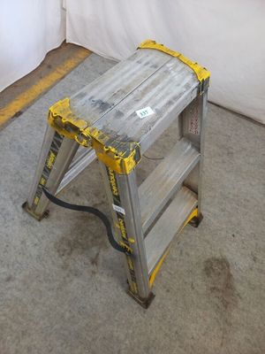 a ladder that is sitting on the floor in a room