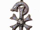 an image of an egyptian cross pendant with blue and white stones