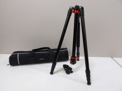 a close up of a tripod and a bag on a table