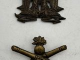 three metal badges of two eagle and two crossed swords