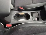 the interior of a car with the center console and center console cup holder