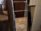 a picture of a kitchen with a refrigerator and cabinets in it
