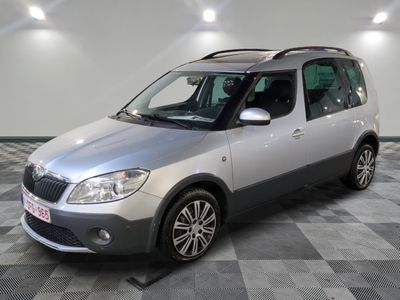 a picture of a silver car parked on a checkered floor