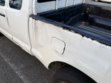 a white truck that is parked in the parking lot