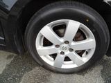 a close up of a tire on a black car
