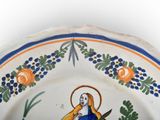 a plate with a picture of a woman on it