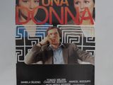 une affiche représentant un homme et une femme devant un mur