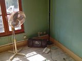 an image of a room with a fan in it