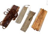 three pieces of wood that are tied up together