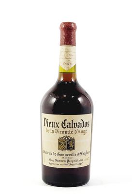 an old bottle of wine sitting on top of a white surface