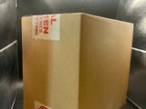 a box that is inside of an oven with a stop sign on it