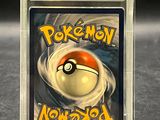 pokemon now card in a plastic case on a table