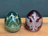 two eggs that are sitting on a wooden table