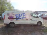a white van that is parked in a lot