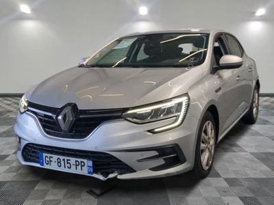 the front of a silver car in a room with checkered floor