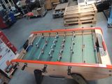 a foosball table in the middle of a room