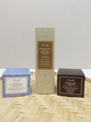 three different types of soaps sitting on top of a bamboo mat