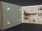 an open book with pictures of people and a plane in it